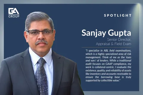 Professional portrait of Sanjay Gupta, Senior Director of Appraisal and Field Exam at GA Group, with a quote on risk management.