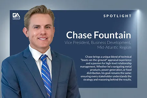 Professional portrait of Chase Fountain, Vice President of Business Development, with blue suit and striped tie.