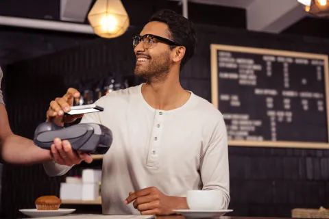 a man holding a cup