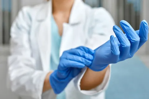 a medical professional wearing gloves