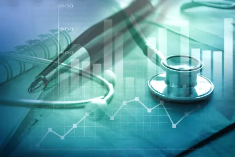 a glass with a blue bowl on a table