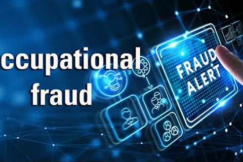 Hand pointing at digital 'Fraud Alert' button with overlaid text reading Occupational fraud on blue tech background.