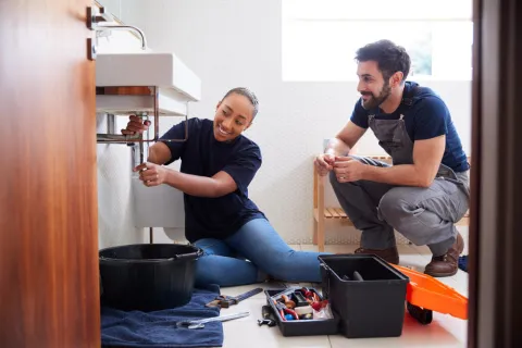 a man and a woman sitting on the floor
