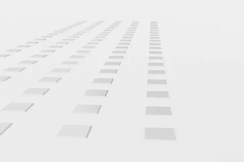 Rows of white 3D squares arranged on a light gray surface creating depth and perspective
