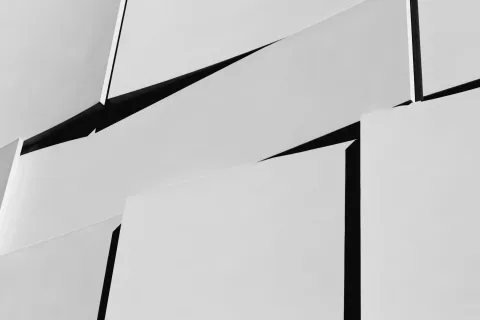 Abstract black and white geometric pattern with sharp angles and overlapping rectangular shapes