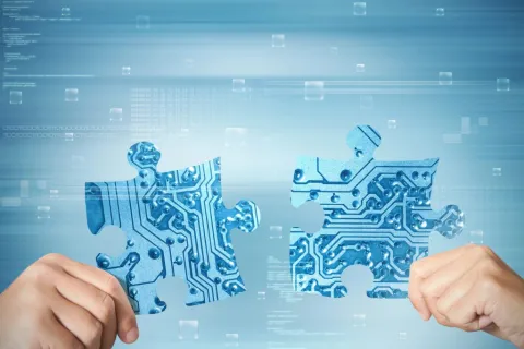 a hand holding a puzzle
