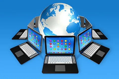 a group of laptops with a globe in the background