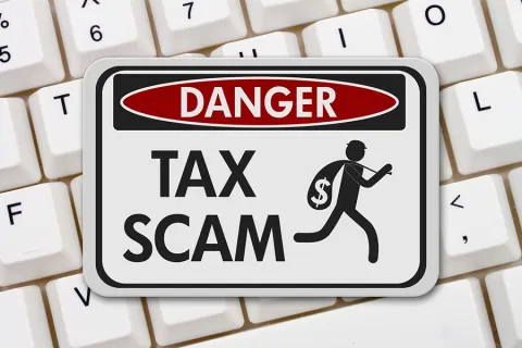 a sign showing a tax scam