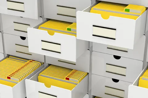 a bunch of white drawers