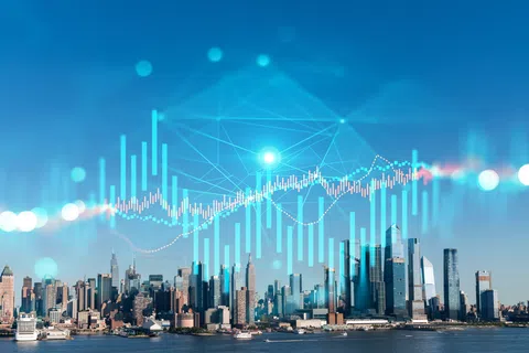 City skyline with digital stock market graph overlay symbolizing financial growth and urban development.