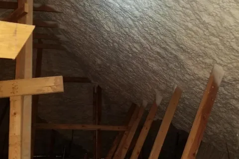 a wooden staircase with a railing