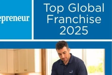 Entrepreneur Top Global Franchise 2025 award banner with man preparing food in kitchen wearing blue gloves.