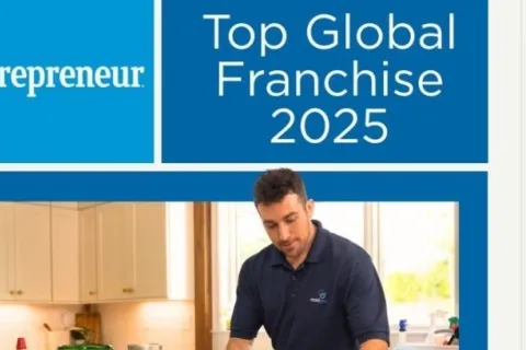 Entrepreneur Top Global Franchise 2025 award banner with man preparing food in kitchen wearing blue gloves.