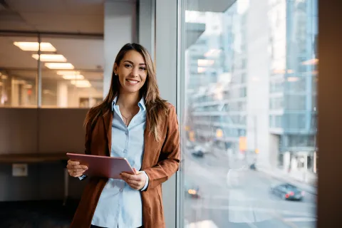 a woman holding a tablet