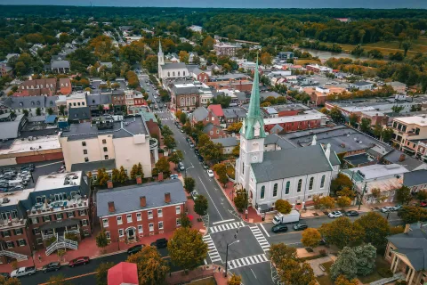 a large city with a green statue