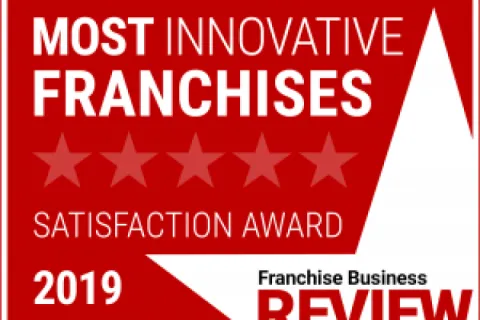 2019 Most Innovative Franchises Satisfaction Award badge from Franchise Business Review in red and white