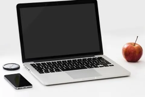 a laptop and apple