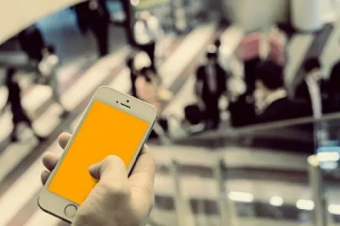 a hand holding a phone
