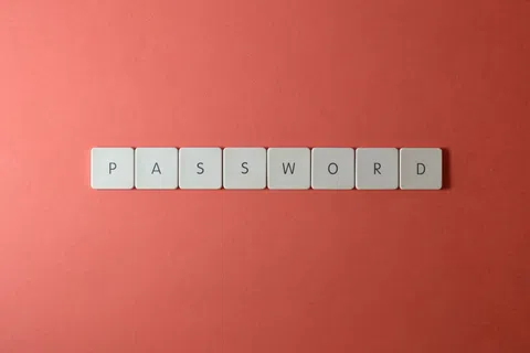 White letter tiles spelling PASSWORD on a red background symbolizing security and login credentials.