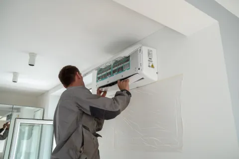 a man drawing on a white board