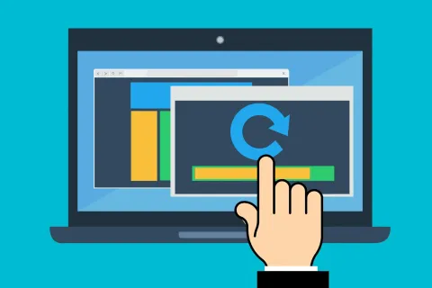 Hand cursor clicking a refresh icon with progress bar on laptop screen during software update process.