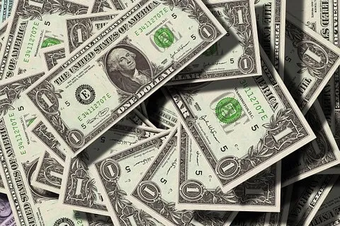 Pile of one dollar bills