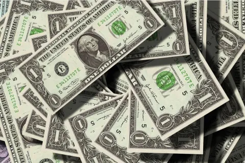 Big pile of one dollar bills