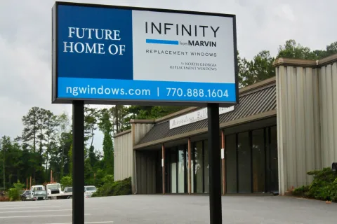 a sign in front of a building
