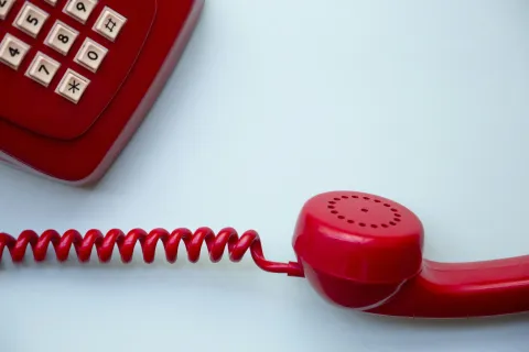 a red cord plugged into a red device