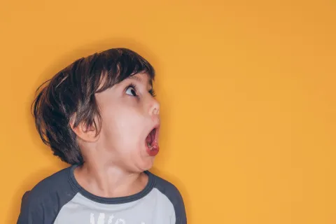 a boy with his mouth open