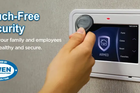 a hand holding a small electronic device
