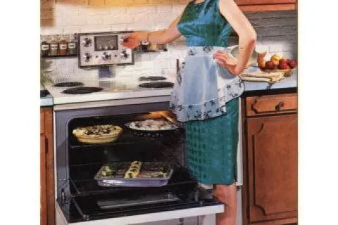 a person standing in front of a stove