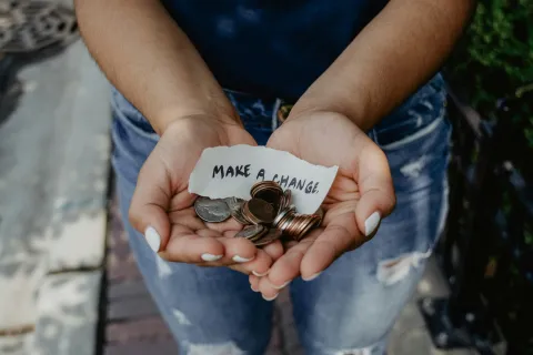a person holding a small box of chocolates