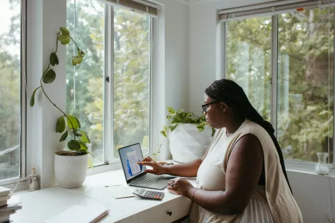 a woman working on her laptop