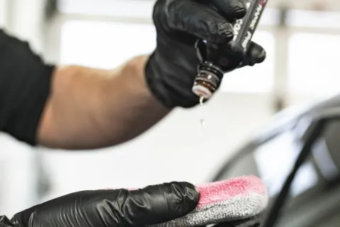 a person wearing gloves and a glove