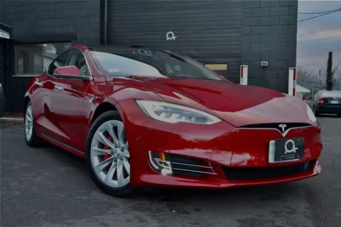 a red car parked in a parking lot