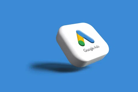 3D Google Ads logo block floating with shadow on blue background with white block and colorful logo