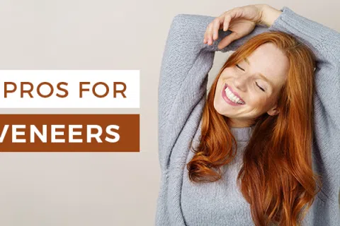 Smiling red-haired woman stretching with text 3 pros for veneers on beige background.