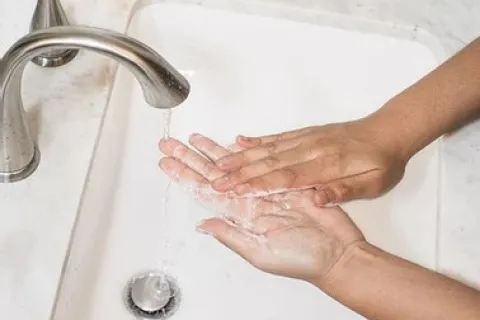 a person washing their hands