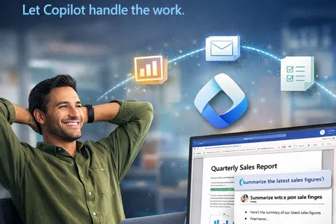 Man relaxing at desk with laptop and monitor showing quarterly sales report using Microsoft Copilot AI features.