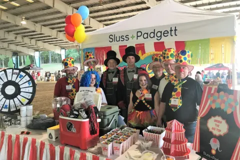 a group of people standing in front of a store