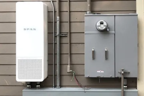 a large metal box with a fan