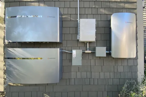a group of white boxes on a brick surface