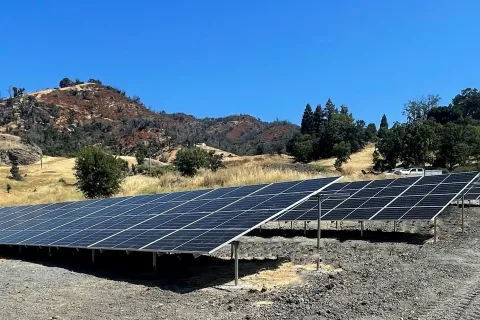 a solar panel on a hill