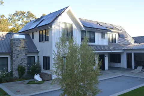 a house with a tree in the front
