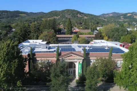 a building with a hill in the background