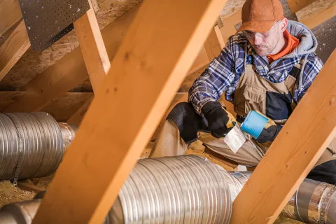 a man working on a piece of wood