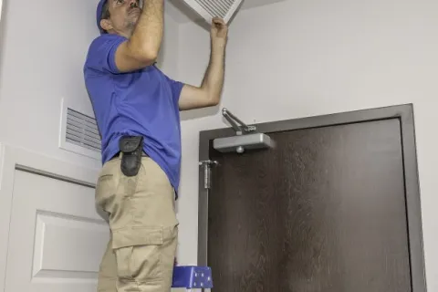 a person holding a door handle