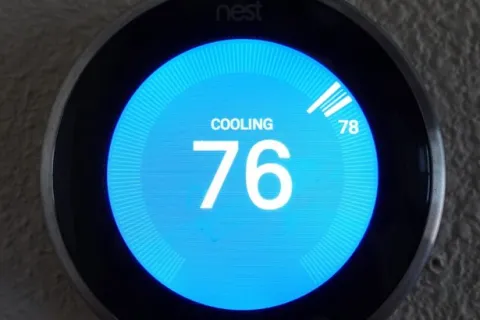 a blue circular object with a white and black text on it