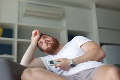 a person lying on a couch